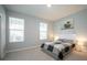 Bright bedroom with a comfortable bed and plenty of natural light at 12749 Brodlove Lane, Winter Garden, FL 34787