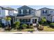 Two-story house with gray siding, landscaping, and a walkway at 12749 Brodlove Lane, Winter Garden, FL 34787