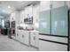 Modern kitchen with white cabinets and stainless steel appliances at 12749 Brodlove Lane, Winter Garden, FL 34787