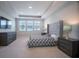 Large main bedroom with comfortable bed, plenty of light, and large windows at 12749 Brodlove Lane, Winter Garden, FL 34787