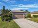 Charming one-story home with a two-car garage at 1878 Monte Cristo Ln, Kissimmee, FL 34758