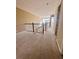 Upper hallway with carpet and access to other rooms at 2018 Gold Spring Cv, Kissimmee, FL 34743