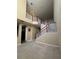 Two-story home interior with open staircase and high ceilings at 2018 Gold Spring Cv, Kissimmee, FL 34743
