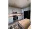 Modern kitchen with light gray cabinets and stainless steel appliances at 2018 Gold Spring Cv, Kissimmee, FL 34743