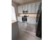 Modern kitchen with light gray cabinets and stainless steel appliances at 2018 Gold Spring Cv, Kissimmee, FL 34743