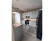 Modern kitchen with light gray cabinets and stainless steel appliances at 2018 Gold Spring Cv, Kissimmee, FL 34743