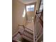 View of living room from upstairs showing high ceilings and large window at 2018 Gold Spring Cv, Kissimmee, FL 34743
