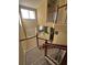 View from upstairs showing stairs and a glimpse of the living area at 2018 Gold Spring Cv, Kissimmee, FL 34743