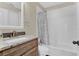 Bathroom with granite countertop and shower/tub combo at 2166 Glossy Privet Dr, Orlando, FL 32828