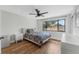 Cozy bedroom with hardwood floors, double bed, and ample natural light at 2254 Ohara Ct # 1055, Orlando, FL 32812