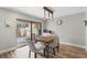 Bright dining area with wooden table and chairs, access to backyard patio at 2254 Ohara Ct # 1055, Orlando, FL 32812