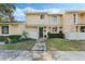 Attractive exterior of a townhome with landscaping and a walkway at 2254 Ohara Ct # 1055, Orlando, FL 32812