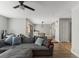 Open living room with sectional sofa, hardwood floors and view of dining area at 2254 Ohara Ct # 1055, Orlando, FL 32812