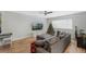 Living room features hardwood floors, sectional sofa, and a Christmas tree at 2254 Ohara Ct # 1055, Orlando, FL 32812