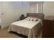 Bright bedroom with a queen-size bed and modern dresser at 2408 Ming Ct, Kissimmee, FL 34744