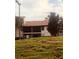 Exterior view of condo building with grassy area at 3036 S Semoran Blvd # S, Orlando, FL 32822