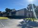 Exterior view of condo building with parking and landscaping at 3036 S Semoran Blvd # S, Orlando, FL 32822