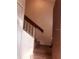 Carpeted stairway with simple railing leading to upper level at 3036 S Semoran Blvd # S, Orlando, FL 32822