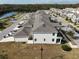 Modern townhome community shown in aerial view next to a small lake and community park at 3125 Aqua Virgo Loop # 56, Orlando, FL 32837