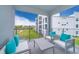Private balcony with seating, offering views of the community at 3150 Paradox Cir # 208, Kissimmee, FL 34746