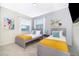 Guest bedroom with twin beds and modern decor at 3150 Paradox Cir # 208, Kissimmee, FL 34746