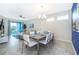 Bright dining room with seating for six, adjacent to the living area at 3150 Paradox Cir # 208, Kissimmee, FL 34746