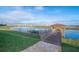 Wooden dock offering lake access and a covered gazebo at 3150 Paradox Cir # 208, Kissimmee, FL 34746