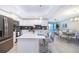 Modern kitchen with white cabinets, quartz countertops, and island at 3150 Paradox Cir # 208, Kissimmee, FL 34746