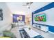 Spacious living room with sectional sofa and large TV at 3150 Paradox Cir # 208, Kissimmee, FL 34746