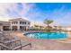 Relaxing community pool with plenty of lounge chairs at 3150 Paradox Cir # 208, Kissimmee, FL 34746