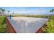 Beach volleyball court with a net and defined playing area at 3150 Paradox Cir # 208, Kissimmee, FL 34746
