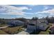 Aerial view showcasing a neighborhood of single-Gathering homes, many with solar panels at 320 Anchovie Ct, Kissimmee, FL 34759