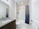 Clean bathroom with a bathtub, shower, and granite countertop at 320 Anchovie Ct, Kissimmee, FL 34759