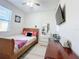 Bedroom with a full-size bed and wooden dresser at 320 Anchovie Ct, Kissimmee, FL 34759