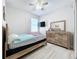 Bedroom with full-size bed, dresser, and TV at 320 Anchovie Ct, Kissimmee, FL 34759