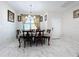 Formal dining room with a chandelier and seating for six at 320 Anchovie Ct, Kissimmee, FL 34759