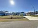 One story house with gray exterior, two car garage, and a well-maintained lawn at 320 Anchovie Ct, Kissimmee, FL 34759