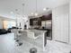 Modern kitchen with granite countertops, stainless steel appliances, and an island at 320 Anchovie Ct, Kissimmee, FL 34759