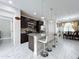 Modern kitchen with granite countertops, stainless steel appliances, and an island with seating at 320 Anchovie Ct, Kissimmee, FL 34759