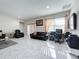Spacious living room with tile floors, a large TV, and comfortable seating at 320 Anchovie Ct, Kissimmee, FL 34759
