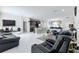 Open living room with tile floors and leather furniture at 320 Anchovie Ct, Kissimmee, FL 34759