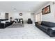 Open living area with multiple seating options and stylish tile floors at 320 Anchovie Ct, Kissimmee, FL 34759