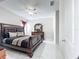 Large main bedroom with a king-size bed and ensuite bathroom at 320 Anchovie Ct, Kissimmee, FL 34759