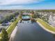 Community pool and lake with surrounding homes at 4012 Santa Maria # 101, Kissimmee, FL 34741
