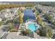 Community pool, playground, and pond, with surrounding townhouses at 4012 Santa Maria # 101, Kissimmee, FL 34741
