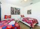 Bedroom with two twin beds, Avengers bedding, and Marvel posters at 4012 Santa Maria # 101, Kissimmee, FL 34741