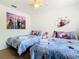 Bedroom with two twin beds, Frozen bedding, and Frozen decor at 4012 Santa Maria # 101, Kissimmee, FL 34741