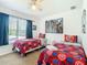 Bedroom with two twin beds, Avengers bedding, and large window at 4012 Santa Maria # 101, Kissimmee, FL 34741