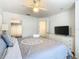 Bright bedroom with king-size bed and access to bathroom at 4012 Santa Maria # 101, Kissimmee, FL 34741