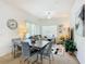 Bright dining area with a table, chairs, and access to living room at 4012 Santa Maria # 101, Kissimmee, FL 34741